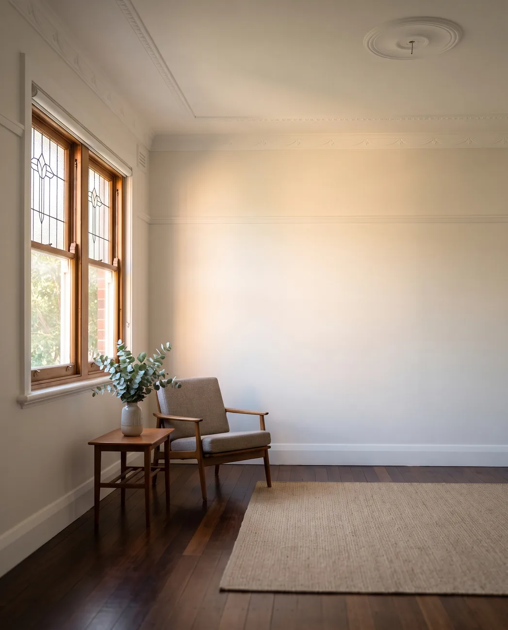 A quiet freshly painted living room in an older Sydney home
